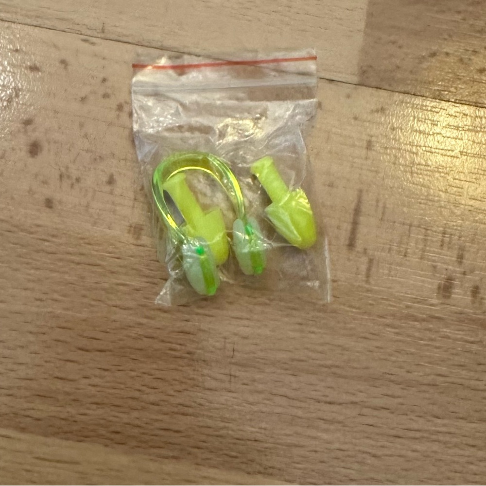 Bright yellow Swim set of ear plugs and nose plug